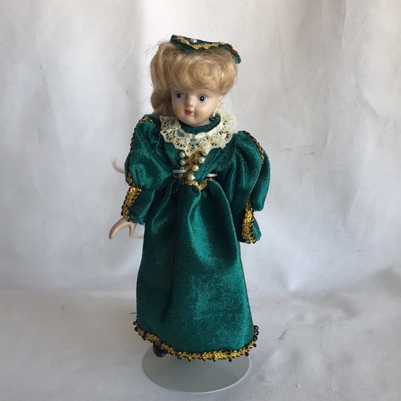 Vintage 8” porcelain doll with green dress on display stand - Picture 1 of 7
